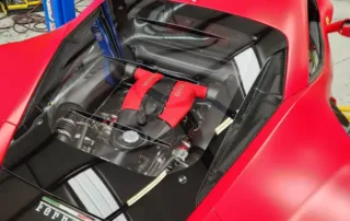 Ferrari Engine Bay Ferrari car engine bay with red and black components