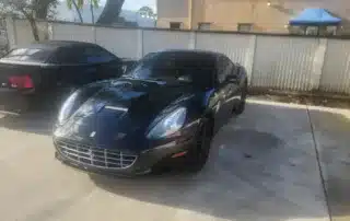 Black Ferrari Parked Next to Sports Car Luxury black Ferrari parked beside another sports car