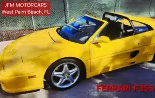 Yellow Ferrari F355 Convertible at JFM Motorcars West Palm Beach Bright yellow Ferrari F355 targa top convertible sports car parked outdoors at JFM Motorcars in West Palm Beach, FL