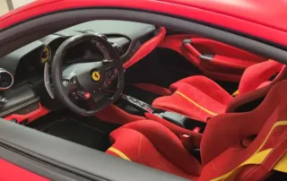 Ferrari Interior Red Seats Red and yellow seats and steering wheel inside a Ferrari