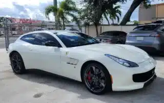 White Ferrari Tinted Windows Parked Outdoors Luxury white Ferrari with tinted windows parked on concrete lot